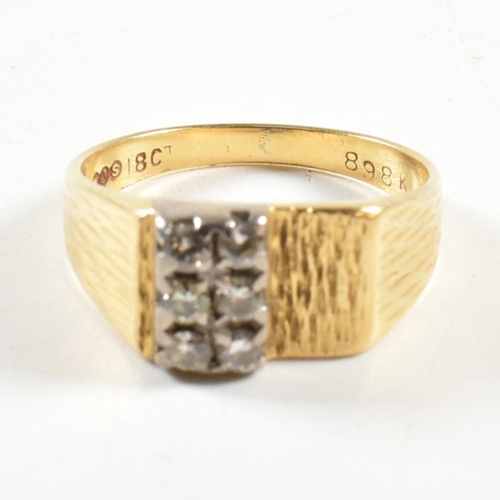 97 - An 18ct gold and diamond ring. The ring set with two rows of three round brilliant cut diamonds to b... 