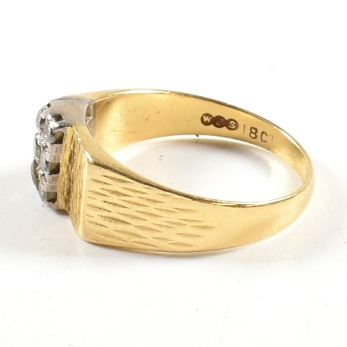 97 - An 18ct gold and diamond ring. The ring set with two rows of three round brilliant cut diamonds to b... 