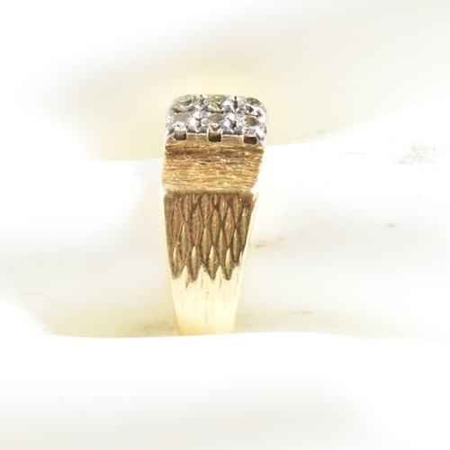 97 - An 18ct gold and diamond ring. The ring set with two rows of three round brilliant cut diamonds to b... 