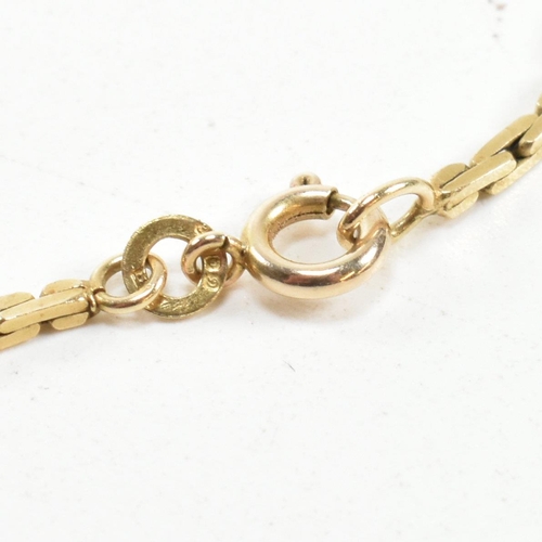 99 - A hallmarked 9ct gold fancy flat link chain. The flat link chain hallmarked for London, 1978. Also m... 