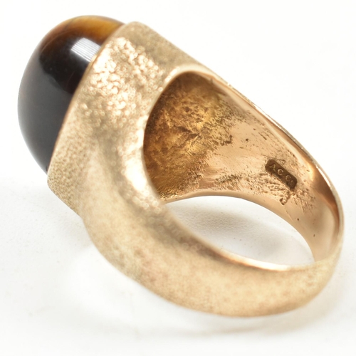 15A - A hallmarked 9ct 1970s gold and tigers eye modernist ring. The ring by the Albion Crafts Company set... 