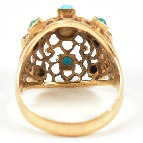 24 - An 18ct gold pearl and turquoise bombe ring. The ring having a pierced filigree style domed head set... 