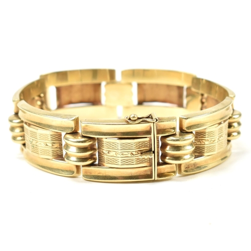 31 - A 14ct gold yellow gold bracelet. The bracelet formed with rectangular tank style links with etched ... 