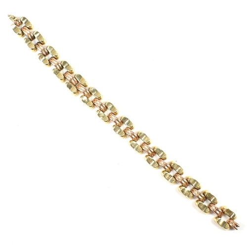 39A - A 14ct bi colour gold bracelet. The bracelet formed with concave and fluted links in yellow and rose... 