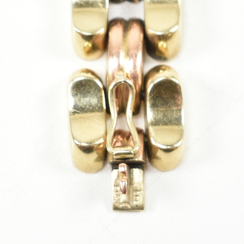 39A - A 14ct bi colour gold bracelet. The bracelet formed with concave and fluted links in yellow and rose... 