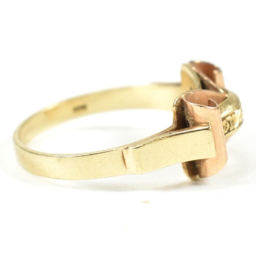 45A - A 14ct gold retro ring. The ring having a scrolled and etched decorated bi colour gold head to plain... 