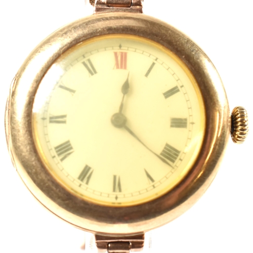 56a - A 9ct gold 15 jewel wrist watch on a 9ct gold expanding bracelet strap. The watch having a white dia... 