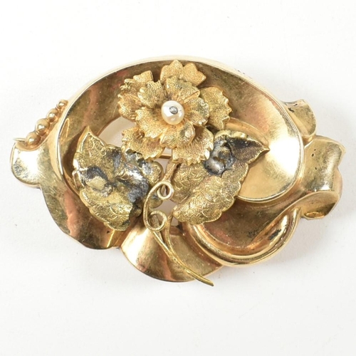 57A - A 19th century gold and pearl brooch pin. The brooch having a floral motif to centre set with a pear... 