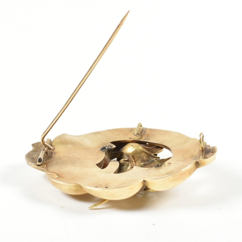 57A - A 19th century gold and pearl brooch pin. The brooch having a floral motif to centre set with a pear... 