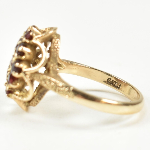 58A - A hallmarked 9ct gold and garnet cluster ring. The ring set with a cluster of round mixed cut garnet... 