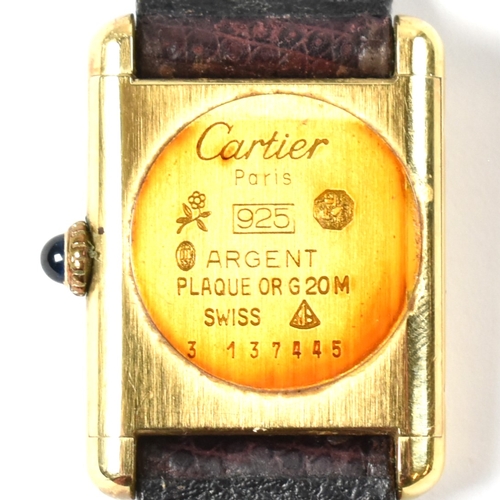 31A - Vintage Must De Cartier tank watch . The watch having a rectangular burgundy dial in a gold plated s... 