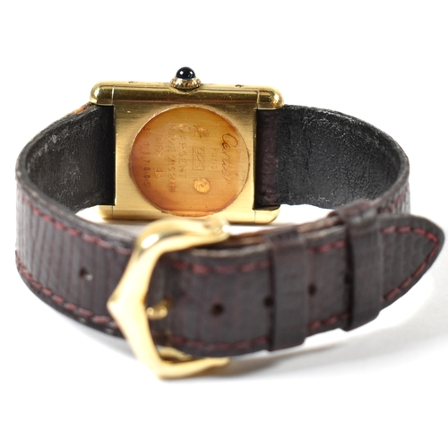 31A - Vintage Must De Cartier tank watch . The watch having a rectangular burgundy dial in a gold plated s... 