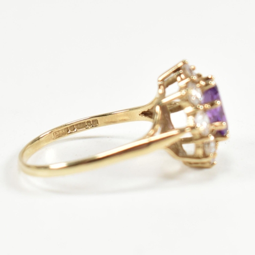 87 - A hallmarked 9ct gold, amethyst and white stone cluster ring. The ring having a central oval cut ame... 