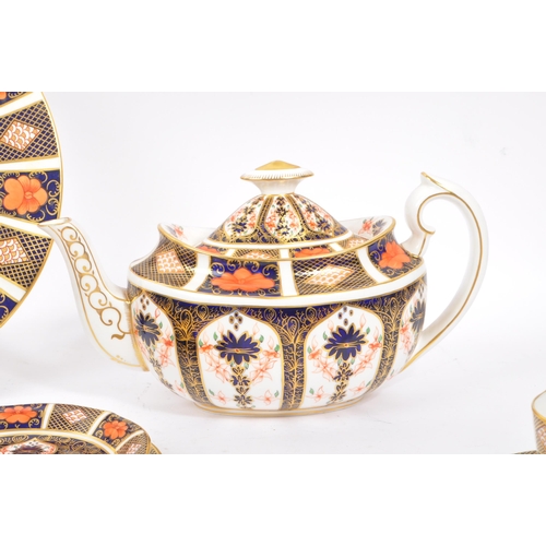 1 - Royal Crown Derby - A vintage 20th century Imari pattern tea service set. To include teapot, cups, s... 