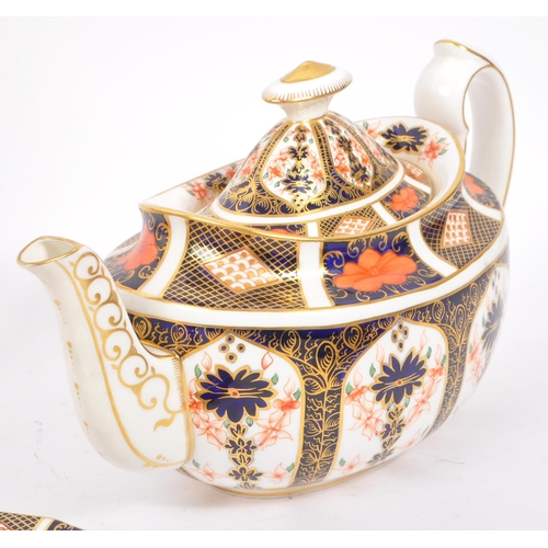 1 - Royal Crown Derby - A vintage 20th century Imari pattern tea service set. To include teapot, cups, s... 