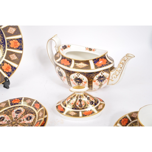 1 - Royal Crown Derby - A vintage 20th century Imari pattern tea service set. To include teapot, cups, s... 