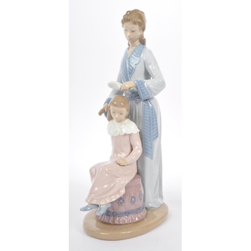 10 - Nao by Lladro - A collection of three 20th Century Nao by Lladro china porcelain figurines to includ... 