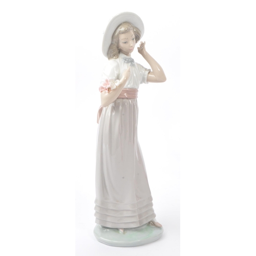 10 - Nao by Lladro - A collection of three 20th Century Nao by Lladro china porcelain figurines to includ... 