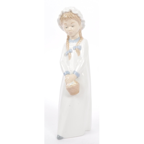 10 - Nao by Lladro - A collection of three 20th Century Nao by Lladro china porcelain figurines to includ... 