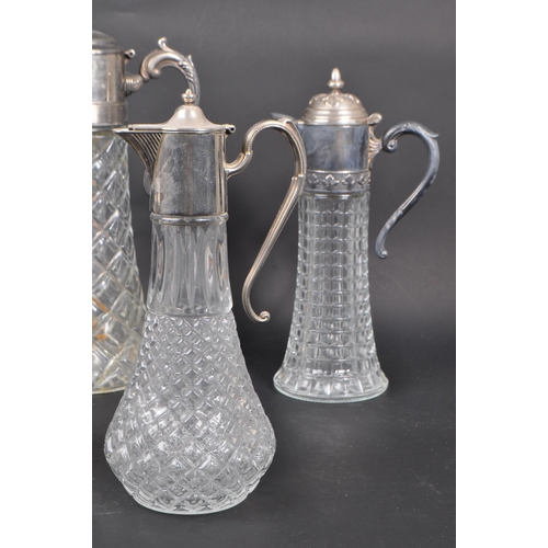 108 - A collection of 20th century Silver Plate cut crystal glass claret jugs / decanters. The collection ... 