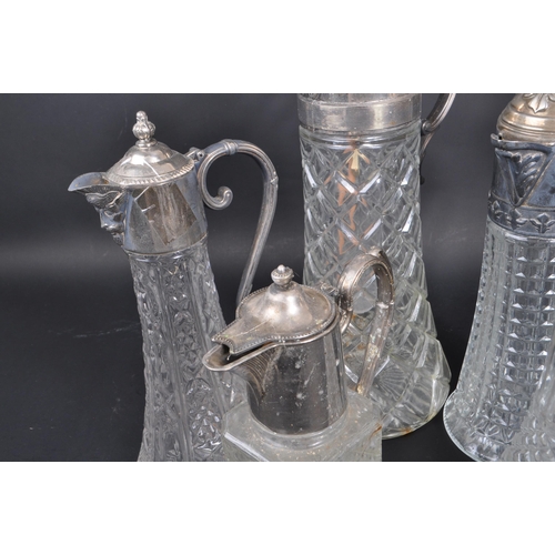 108 - A collection of 20th century Silver Plate cut crystal glass claret jugs / decanters. The collection ... 