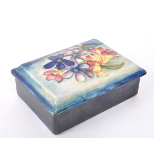 115 - Moorcraft - An early 20th Century 1930s china porcelain lidded pot of rectangular form having wild f... 