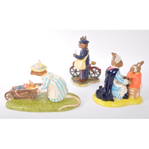 120 - Royal Doulton - A collection of three china porcelain figures to include two Bunnykins comprising of... 