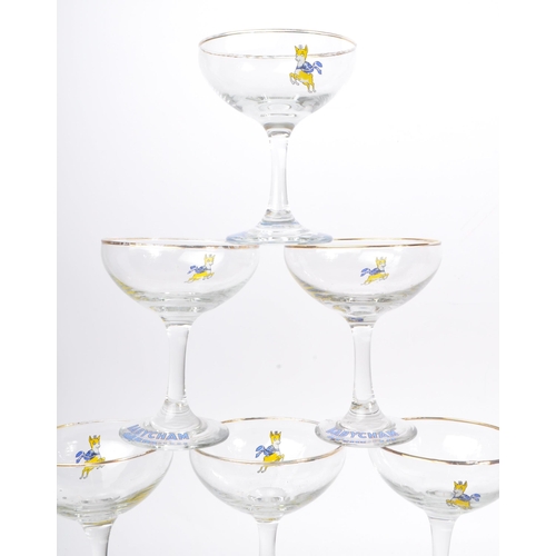 127 - Babycham - A collection of mid 20th century Babycham coupe glasses alongside a bottle of Special Edi... 