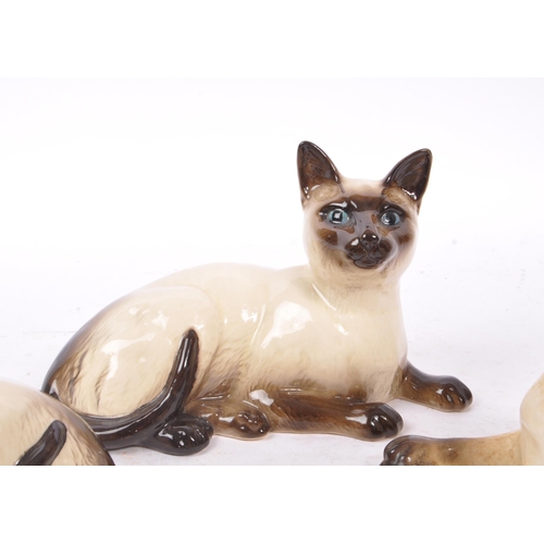 147 - Royal Doulton - A collection of six 20th Century vintage china porcelain Royal Doulton siamese cat f... 