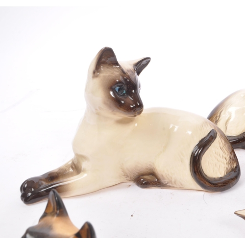 147 - Royal Doulton - A collection of six 20th Century vintage china porcelain Royal Doulton siamese cat f... 