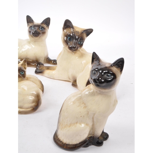 147 - Royal Doulton - A collection of six 20th Century vintage china porcelain Royal Doulton siamese cat f... 