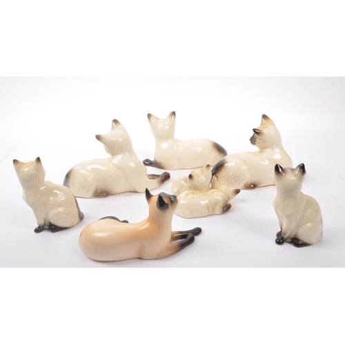 147 - Royal Doulton - A collection of six 20th Century vintage china porcelain Royal Doulton siamese cat f... 