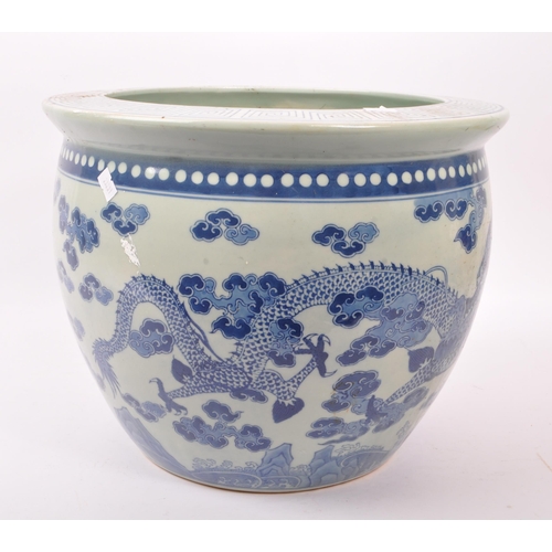 15 - A large 20th Century Chinese porcelain blue and white jardiniere / planter of circular form having C... 