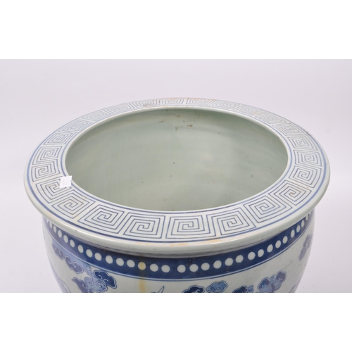 15 - A large 20th Century Chinese porcelain blue and white jardiniere / planter of circular form having C... 