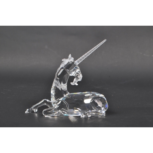 150 - Swarovski - Two crystal glass Swarovski figurines / ornaments comprising of a boxed Millenium editio... 