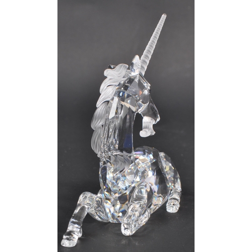 150 - Swarovski - Two crystal glass Swarovski figurines / ornaments comprising of a boxed Millenium editio... 