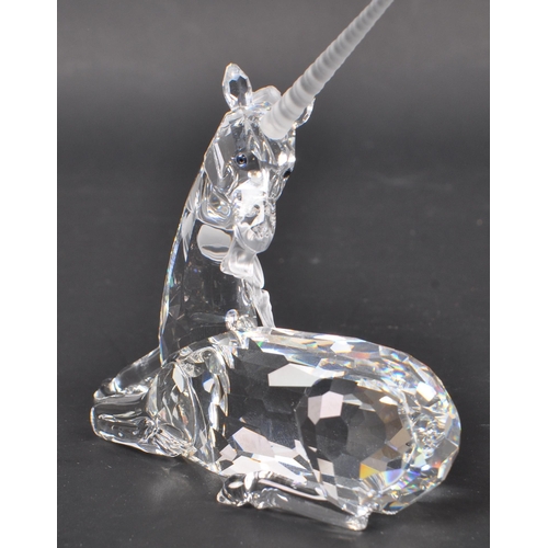 150 - Swarovski - Two crystal glass Swarovski figurines / ornaments comprising of a boxed Millenium editio... 