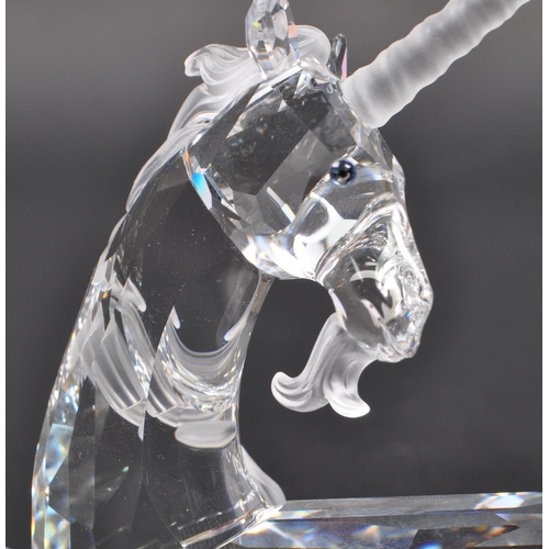 150 - Swarovski - Two crystal glass Swarovski figurines / ornaments comprising of a boxed Millenium editio... 