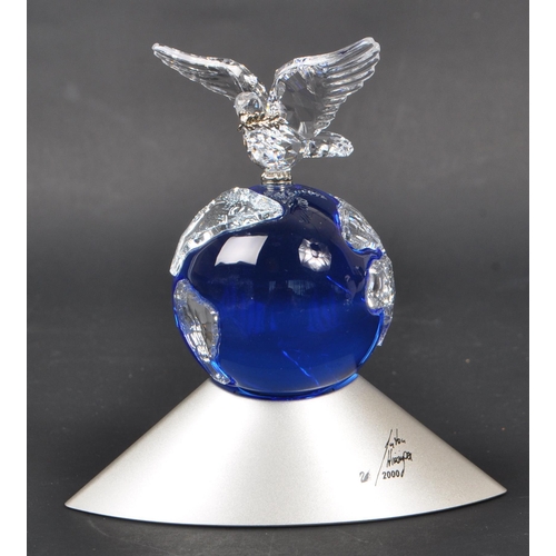 150 - Swarovski - Two crystal glass Swarovski figurines / ornaments comprising of a boxed Millenium editio... 