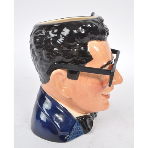 152 - Royal Doulton - A large china Royal Doulton character jug in the form of Buddy Holly D7100 issued in... 