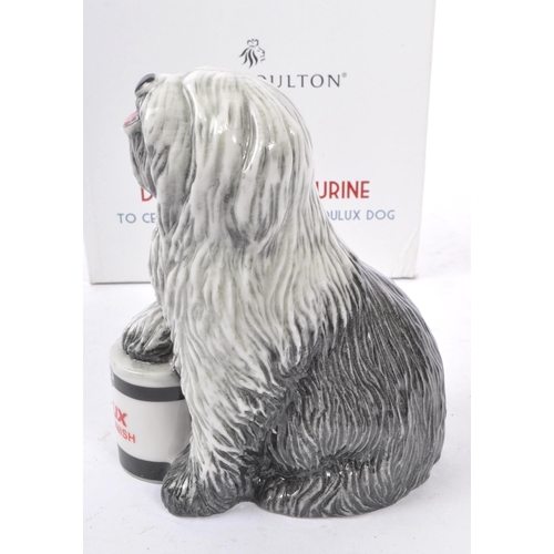 153 - Royal Doulton - A china handmade Royal Doulton figurine in the form of a Dulux dog RDA144 celebratin... 