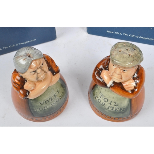 157 - Royal Doulton - A pair of late 20th Century china Royal Doulton salt and pepper figures one in the f... 