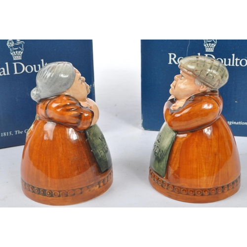 157 - Royal Doulton - A pair of late 20th Century china Royal Doulton salt and pepper figures one in the f... 