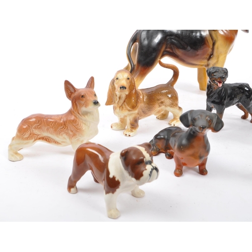 172 - Beswick - A collection of 20th Century vintage china porcelain figurines in the form of dogs compris... 