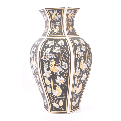 178 - A vintage 20th century Italian gilt decorated ceramic vase. The vase having a white ground with blac... 