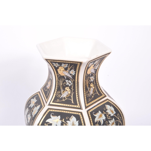 178 - A vintage 20th century Italian gilt decorated ceramic vase. The vase having a white ground with blac... 