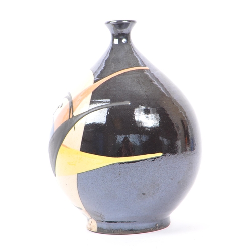 179 - A vintage mid 20th century possibly Italian studio art pottery vase. The vase having a black ground,... 