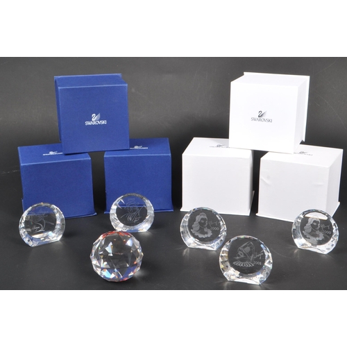 18 - Swarovski - A collection of boxed Swarovski crystal paperweights. The collection to include a total ... 