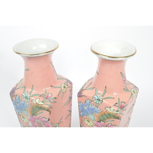 193 - A pair of 1950s mid 20th century Chinese porcelain vases. The vases having flared rim over waisted n... 