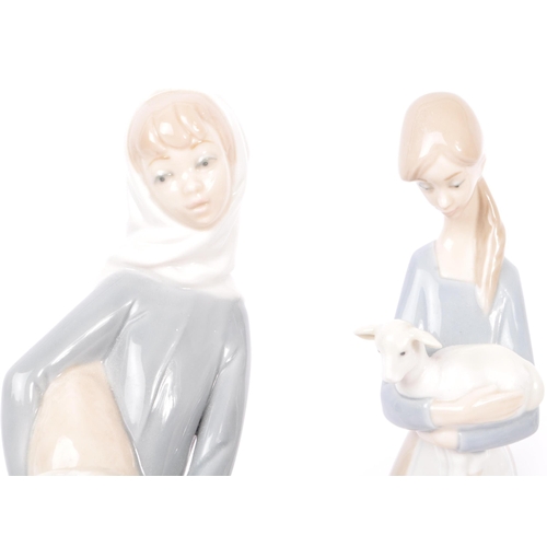 201 - Lladro / Nao - A collection of Lladro & Nao china figures, alongside other similar examples. The col... 